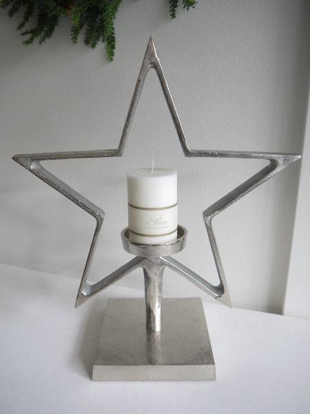 Stjärnformad-ljusstake-i-ruff-silver