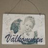Valkommen-skylt-med-anglar-1