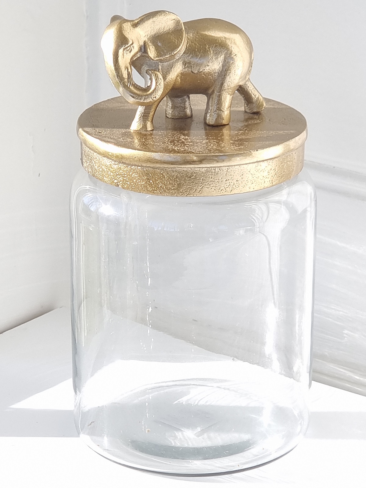 Glasburk lock i guld med elefant. Besök blickfång.se
