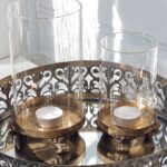 Ljuslykta glascylinder på fat lejontassar. Besök blickfång.se