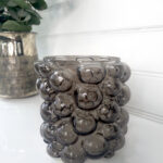 Ljuslykta med bubblor i glas. Besök blickfång.se